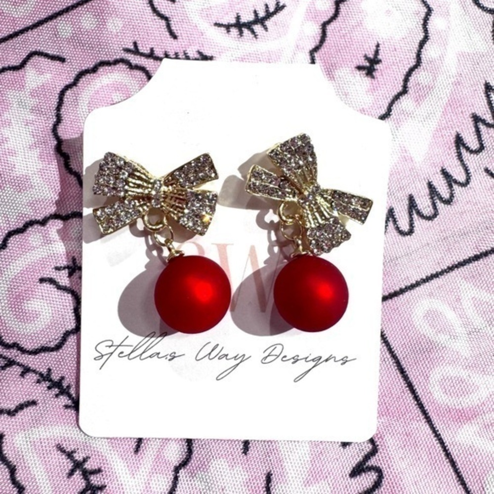 Gold bow dangle earrings